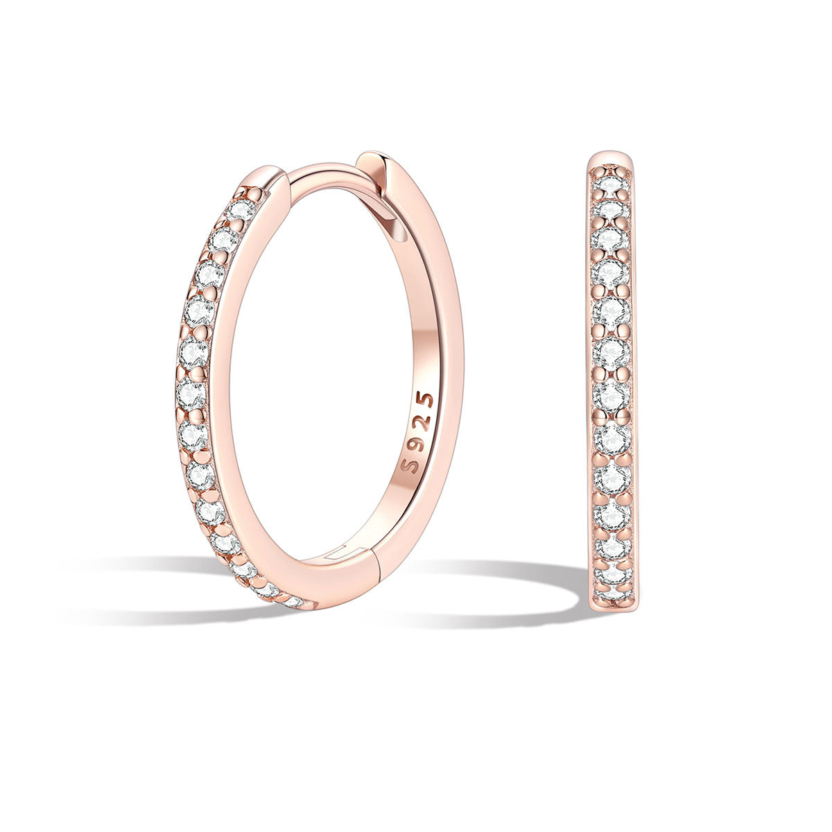 Rose gold huggie hoop earrings with embedded diamonds on a white background