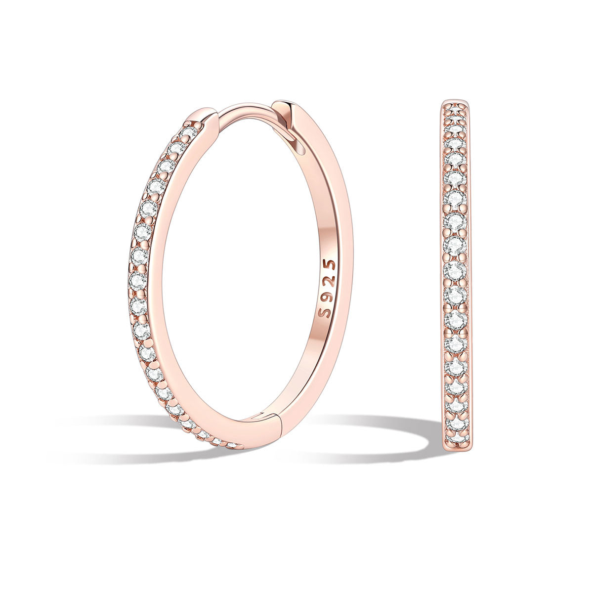 Rose gold huggiehoop earrings with embedded diamonds on a white background