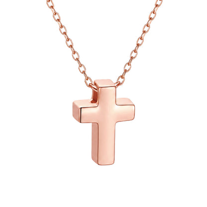 Rose gold cross necklace on a white background