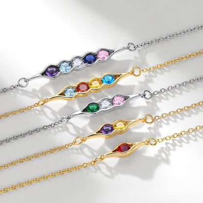 Set of colorful gemstone peat in pot bracelets on a light background