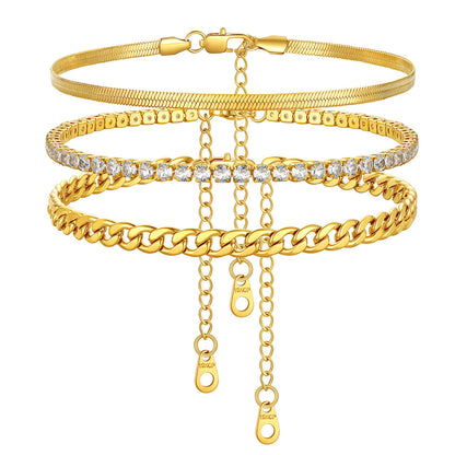 Set of gold anklet  bracelets with various designs on a white background
