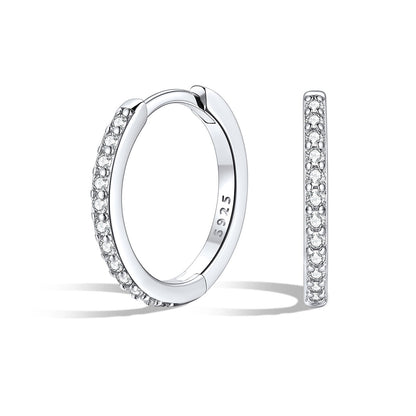 Silver 12mm huggie earrings with embedded stones on a white background