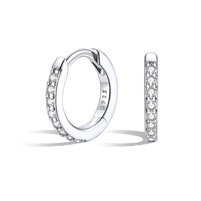 Silver 8mm huggie earrings with embedded stones on a white background