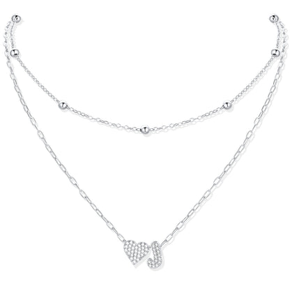 Silver CZ initial J necklace with a heart-shaped pendant on a white background