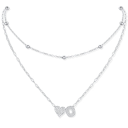 Silver CZ initial O necklace with a heart-shaped pendant on a white background