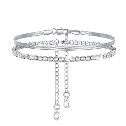 Silver Herringbone & Tennis anklets with chain on a white background