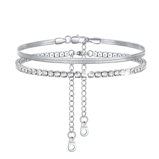 Silver Herringbone & Tennis anklets with chain on a white background