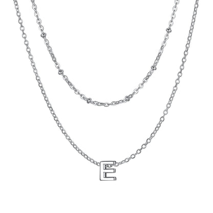 Silver Layered initial E necklace on a white background