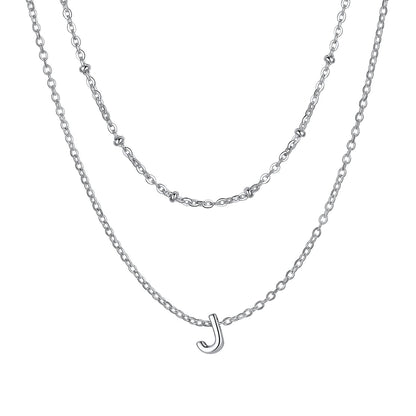 Silver Layered initial J necklace on a white background