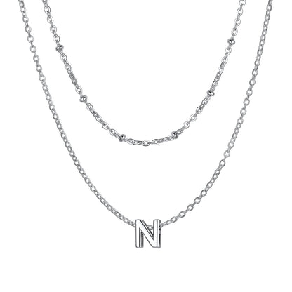 Silver Layered initial N necklace on a white background