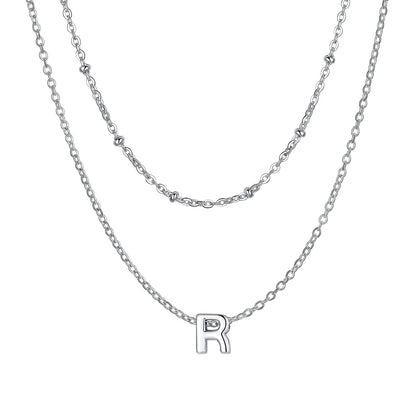 Silver Layered initial R necklace on a white background