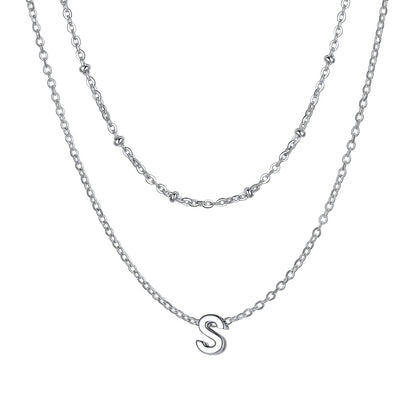 Silver Layered initial S necklace on a white background