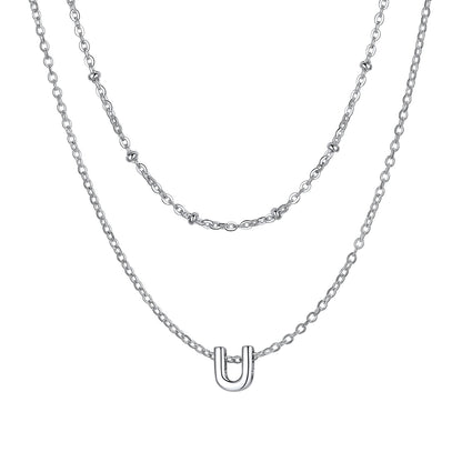 Silver Layered initial U necklace on a white background