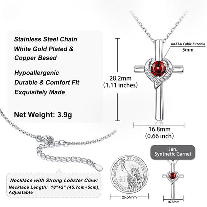 Silver cross pendant necklace with a red cubic zirconia heart and a stainless steel lobster claw clasp, shown with product specifications, dimensions, and a coin scale reference on a white background.