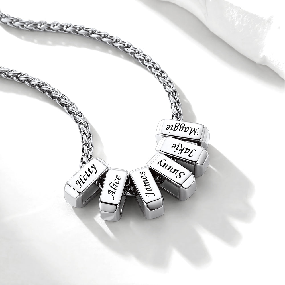 Silver custom engraved necklace on a white background