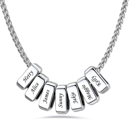 Silver custom name necklace with 7 rectangular pendant engraved on a white background