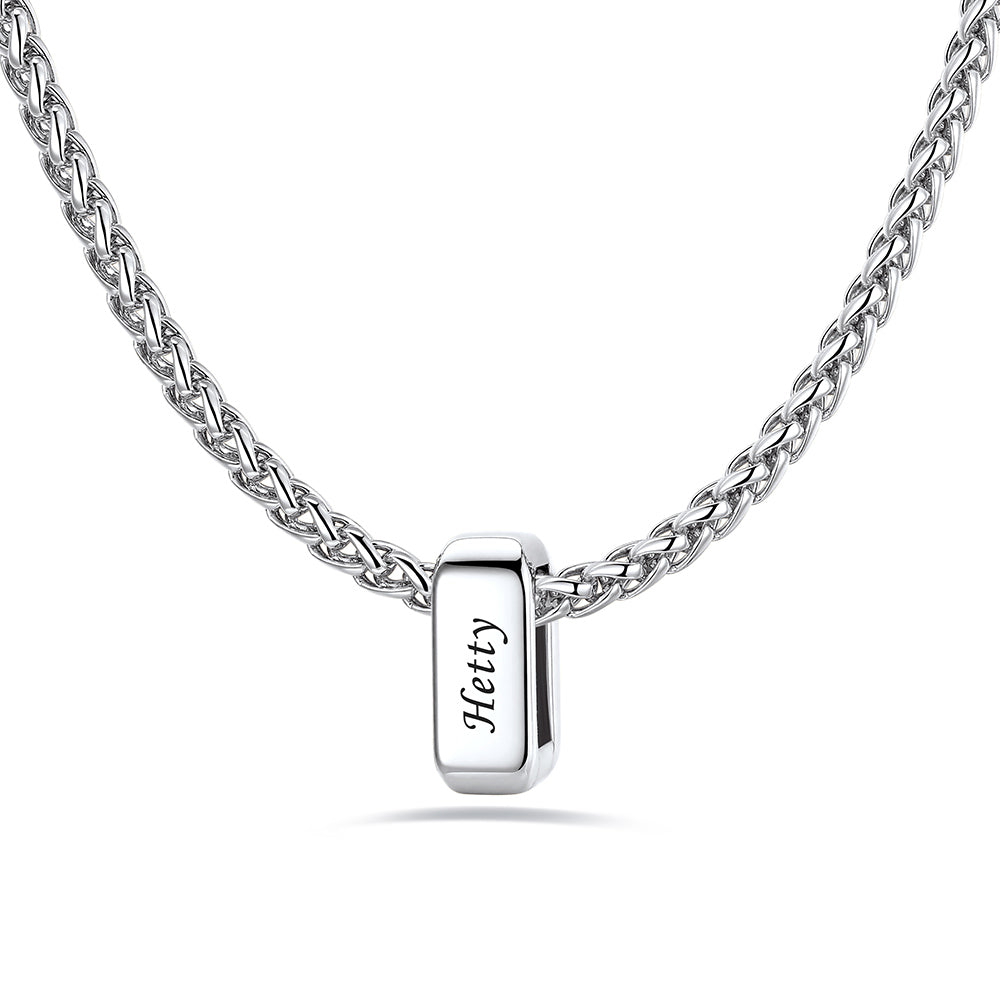Silver custom name necklace with a rectangular pendant engraved on a white background