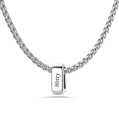 Silver custom name necklace with a rectangular pendant engraved on a white background