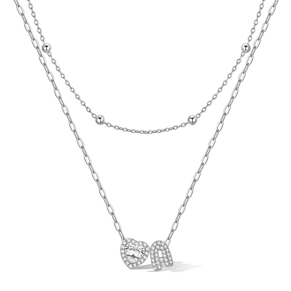 Silver cz bubble initial A necklace with a heart-shaped pendant on a white background