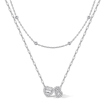 Silver cz bubble initial B necklace with a heart-shaped pendant on a white background