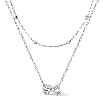 Silver cz bubble initial C necklace with a heart-shaped pendant on a white background