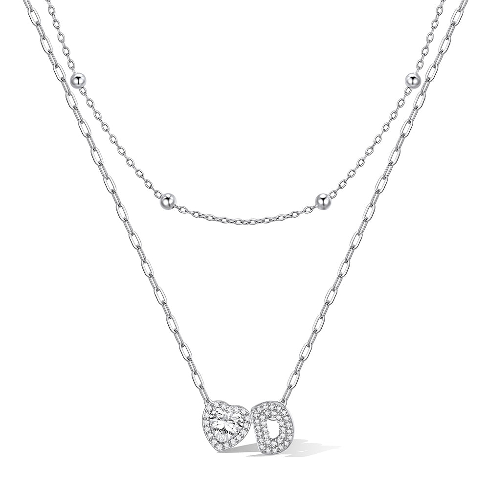 Silver cz bubble initial D necklace with a heart-shaped pendant on a white background