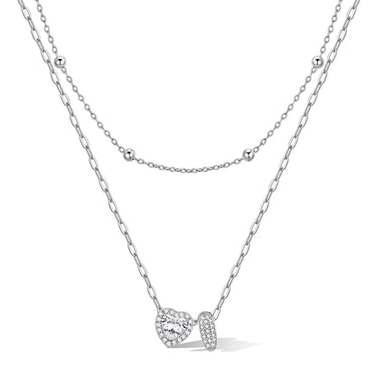 Silver cz bubble initial I necklace with a heart-shaped pendant on a white background