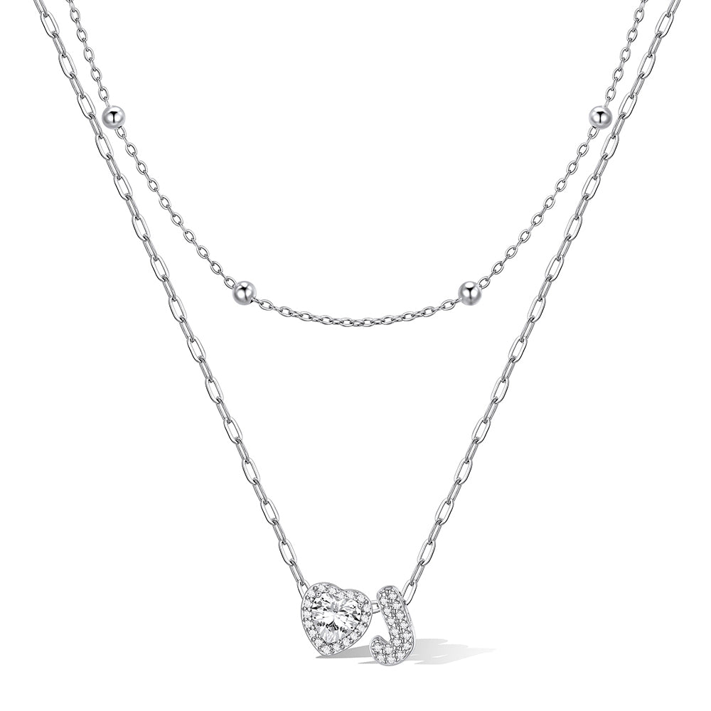 Silver cz bubble initial J necklace with a heart-shaped pendant on a white background