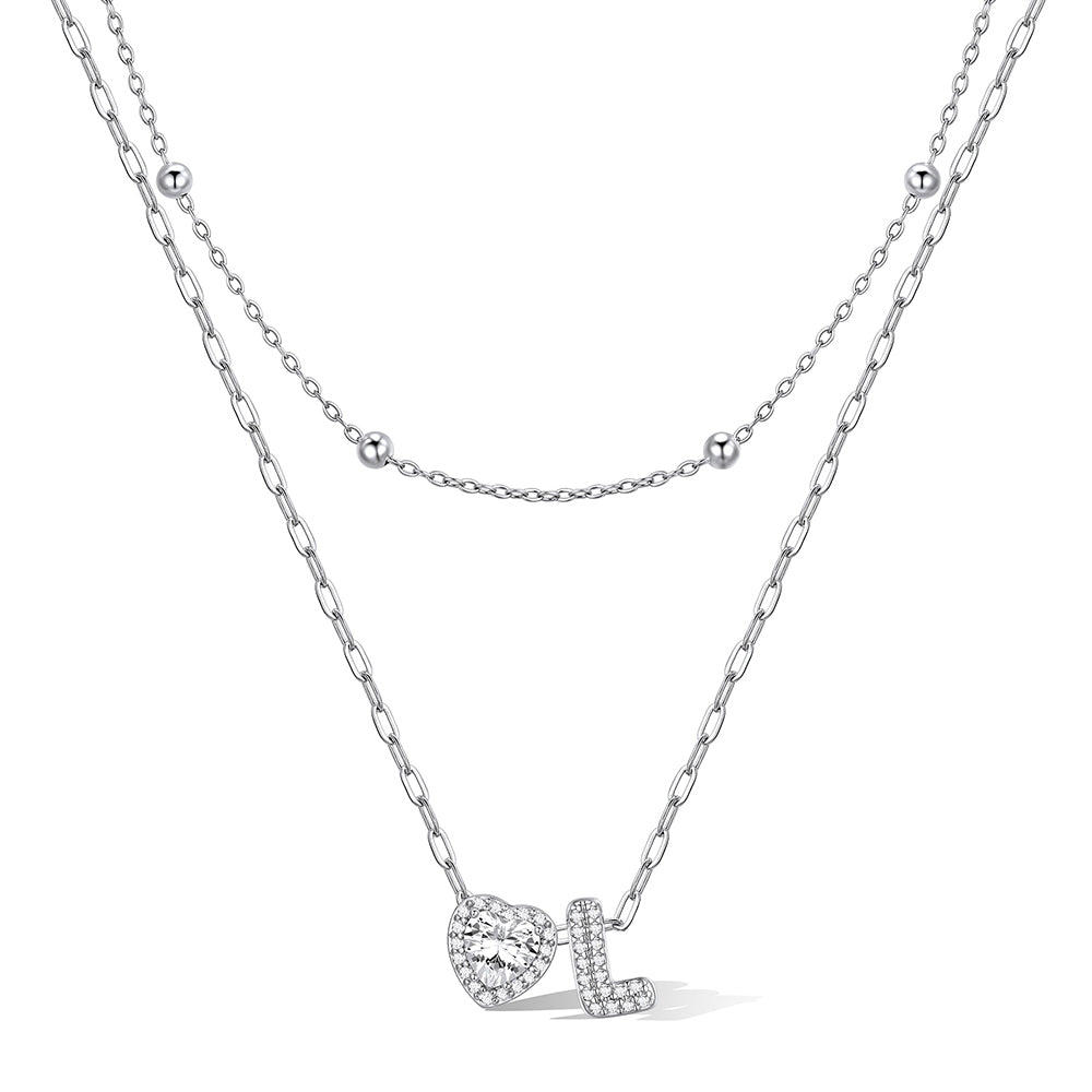 Silver cz bubble initial L necklace with a heart-shaped pendant on a white background