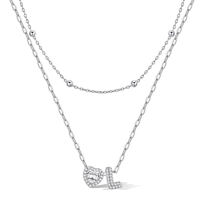 Silver cz bubble initial L necklace with a heart-shaped pendant on a white background