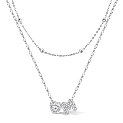 Silver cz bubble initial M necklace with a heart-shaped pendant on a white background