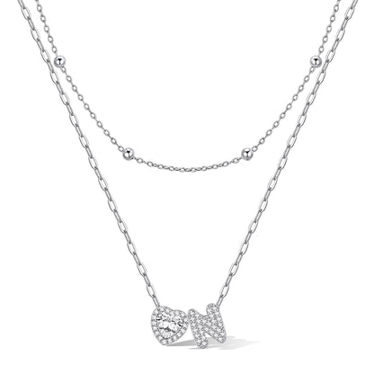 Silver cz bubble initial N necklace with a heart-shaped pendant on a white background