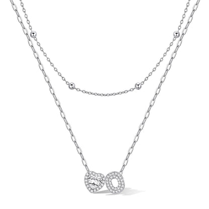 Silver cz bubble initial O necklace with a heart-shaped pendant on a white background