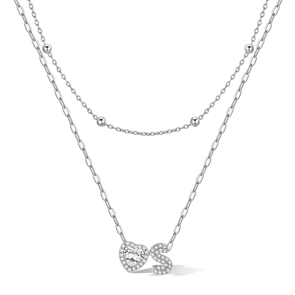 Silver cz bubble initial S necklace with a heart-shaped pendant on a white background