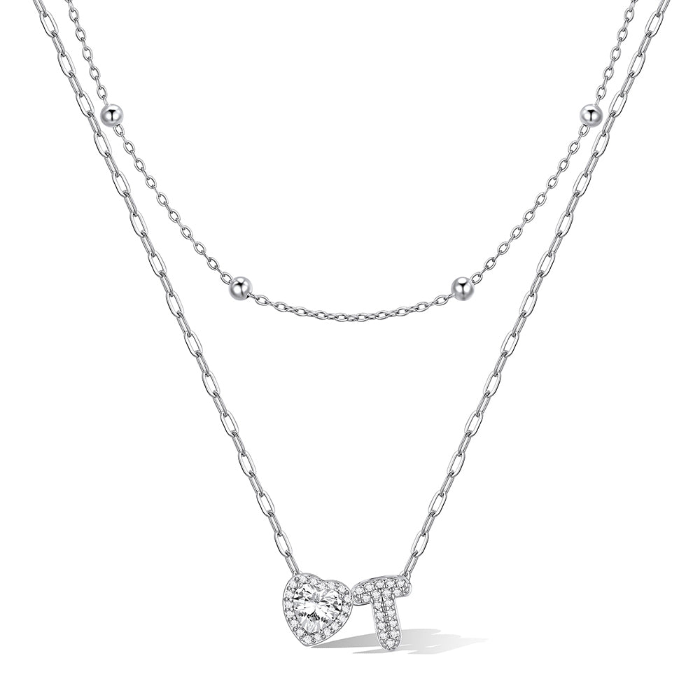 Silver cz bubble initial T necklace with a heart-shaped pendant on a white background