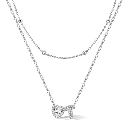 Silver cz bubble initial T necklace with a heart-shaped pendant on a white background