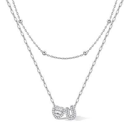Silver cz bubble initial U necklace with a heart-shaped pendant on a white background