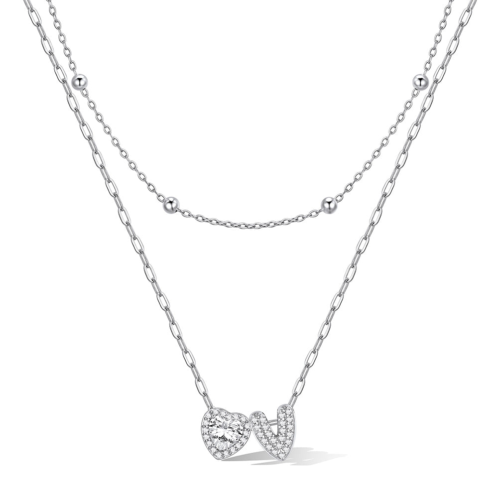 Silver cz bubble initial V necklace with a heart-shaped pendant on a white background