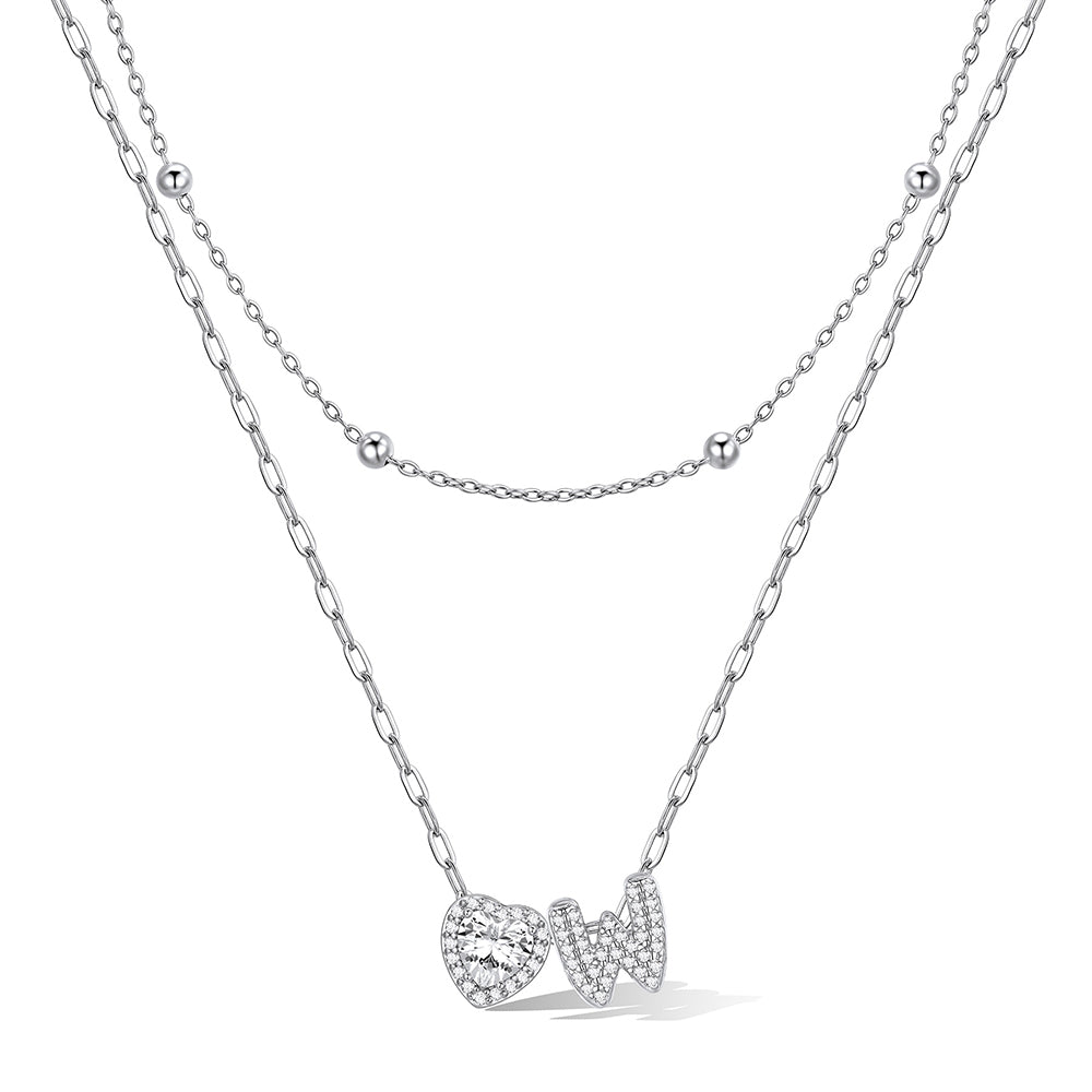 Silver cz bubble initial W necklace with a heart-shaped pendant on a white background