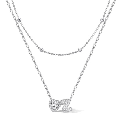 Silver cz bubble initial Z necklace with a heart-shaped pendant on a white background