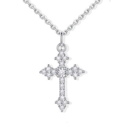 Silver cz cross pendant necklace on a white background