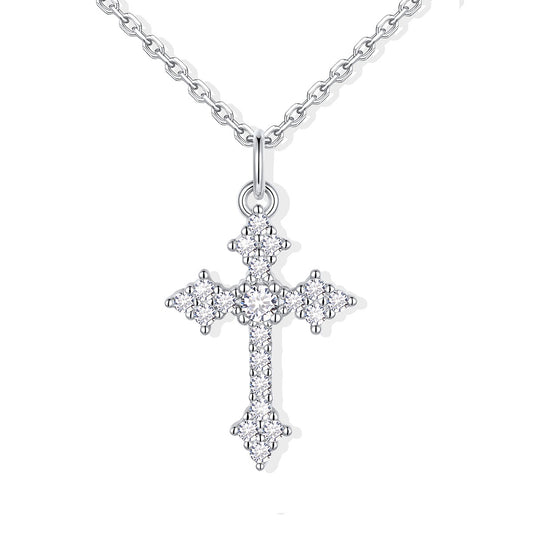 Silver cz cross pendant necklace on a white background