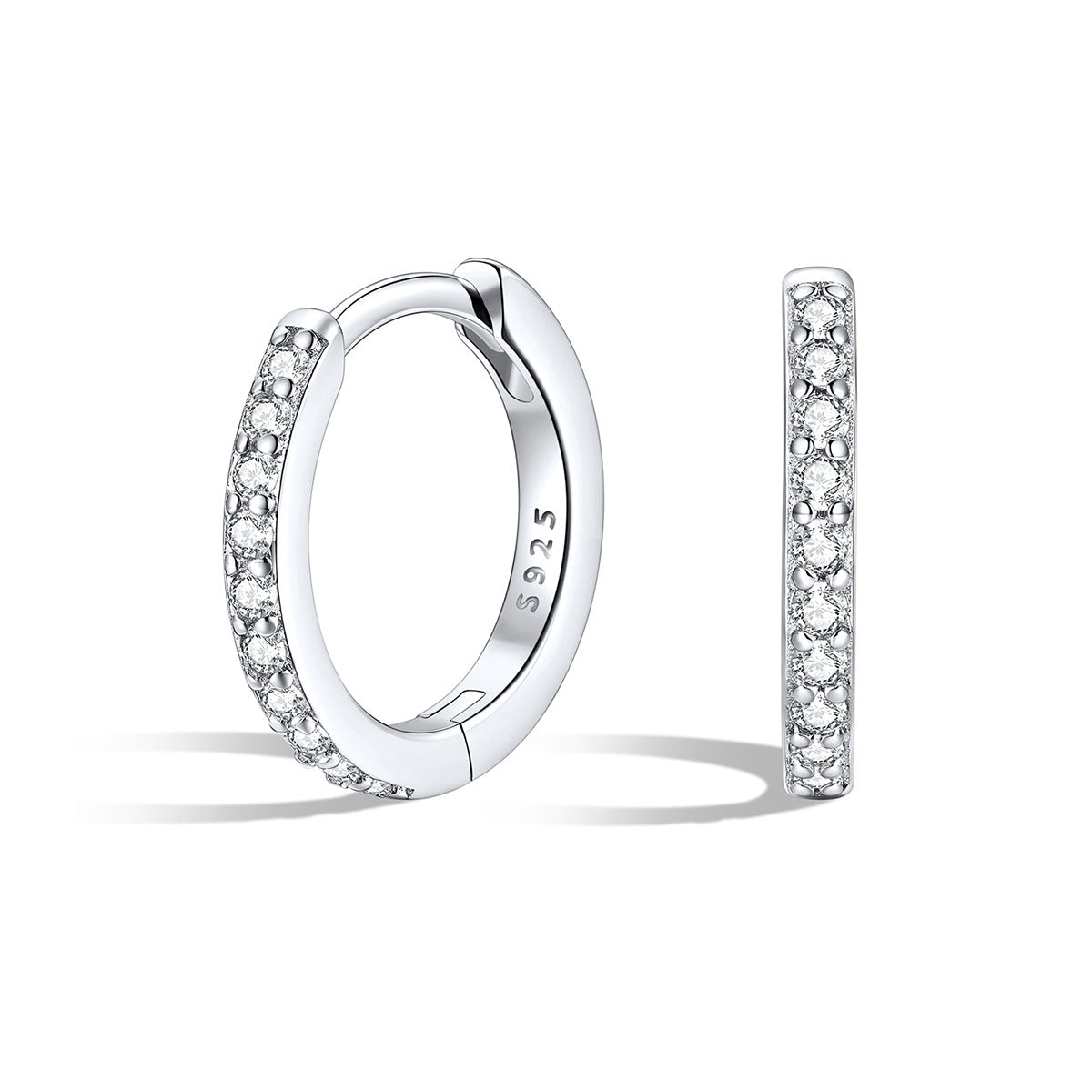 Silver cz huggie earrings with embedded stones on a white background