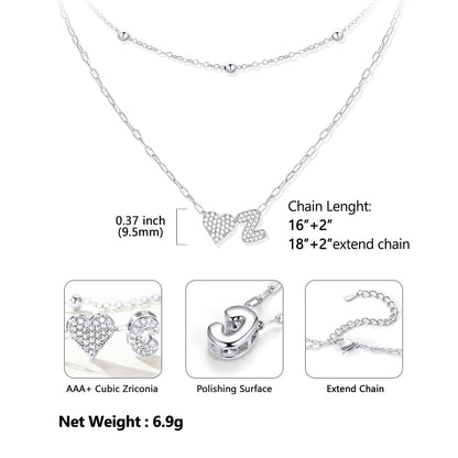 Silver cz initial necklace with cubic zirconia details on a white background