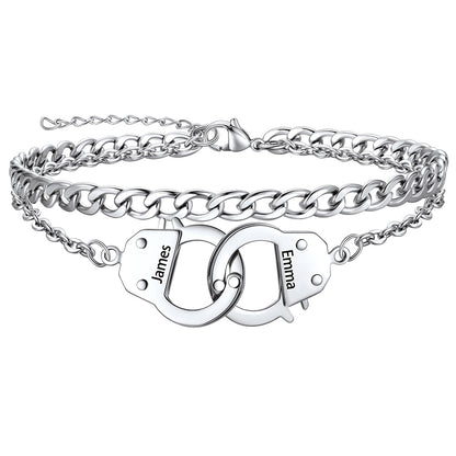 Silver handcuff ankle bracelet with interlocking heart charms engraved with names on a white background