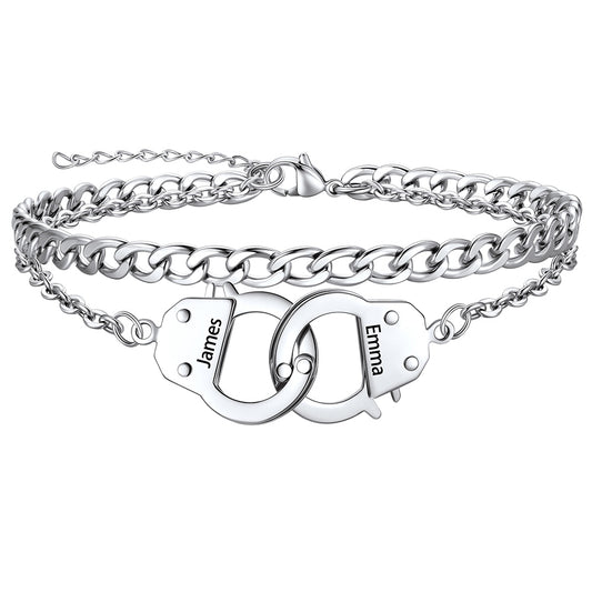 Silver handcuff ankle bracelet with interlocking heart charms engraved with names on a white background