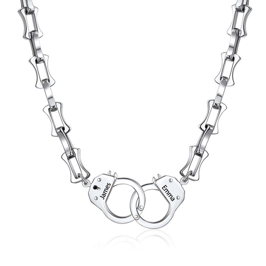 Silver handcuff bamboo link necklace with handcuff pendants engraved with names on a white background