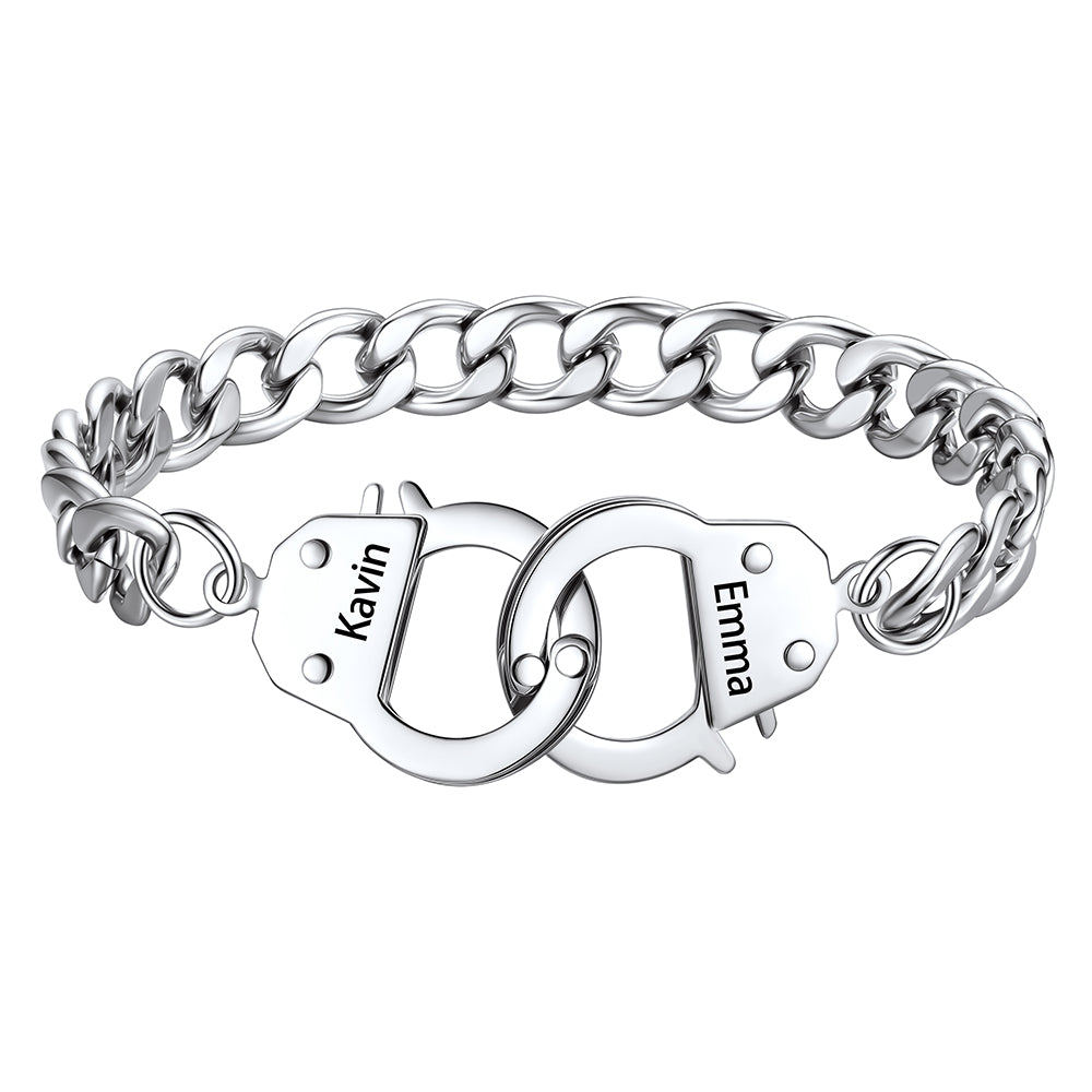 Silver handcuff chain bracelet with interlocking heart charms engraved with names on a white background
