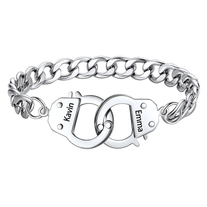 Silver handcuff chain bracelet with interlocking heart charms engraved with names on a white background