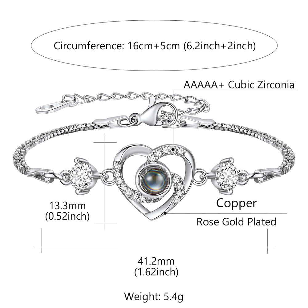 Silver heart photo projection bracelet with heart design and measurements on a white background